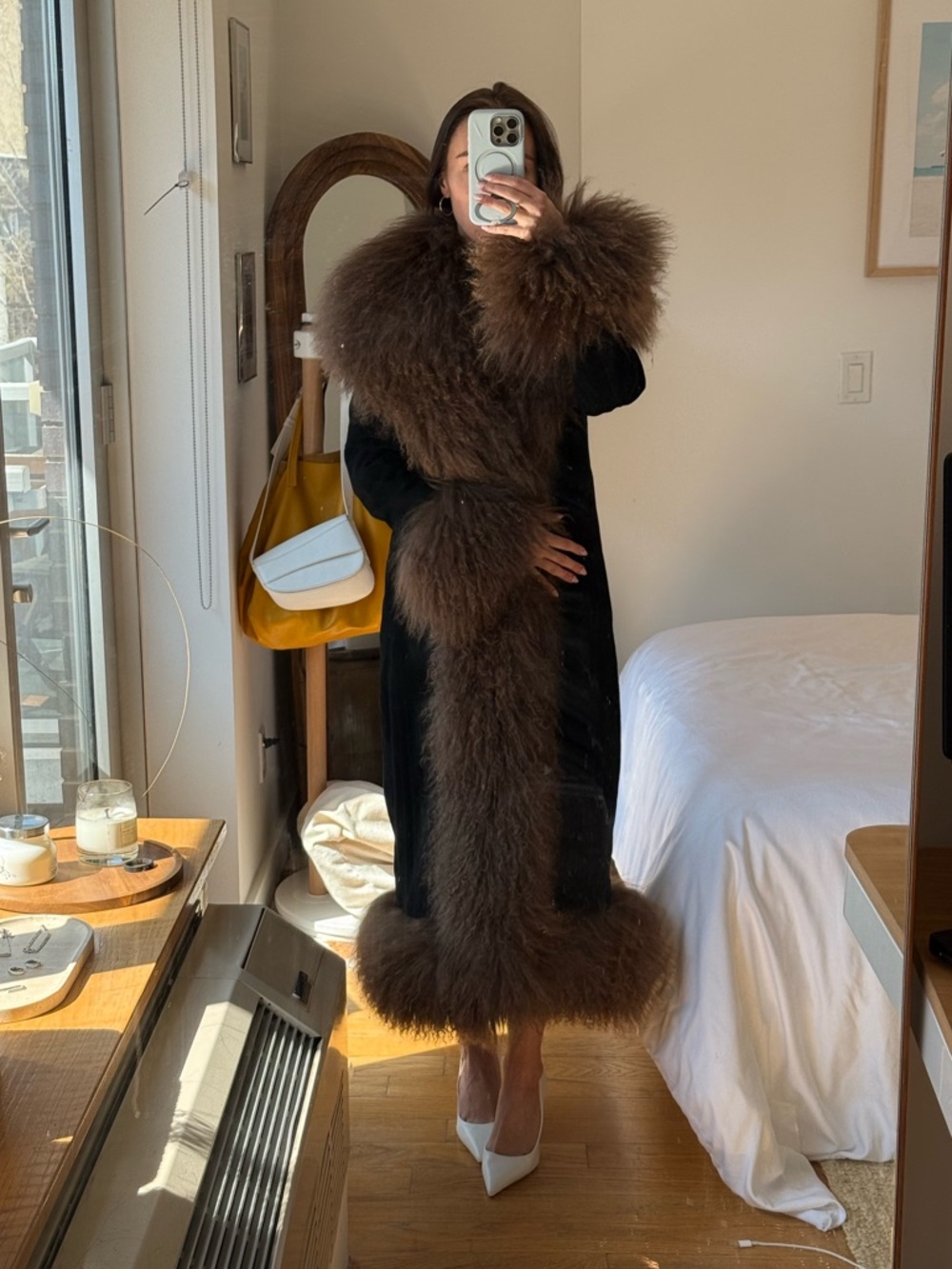 Dramatic Black Coat with Voluminous Brown Fur Trim